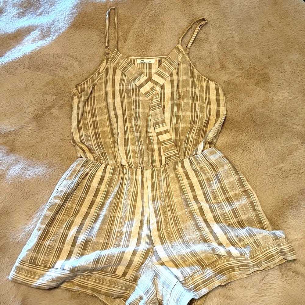 Nuetral Romper with elastic waist and adjustable straps.